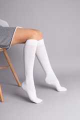 Гольфи жіночі білого кольору до коліна